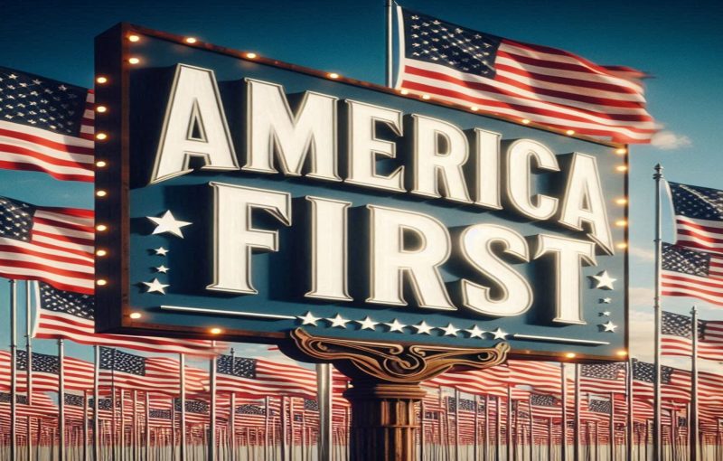 A bold sign with the words America First prominently displayed in large, patriotic font. Behind th